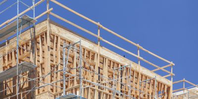 Scaffolding and Wood Framing at Construction Site.